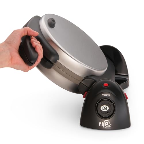 Hand holding a silver and black waffle maker on a white background