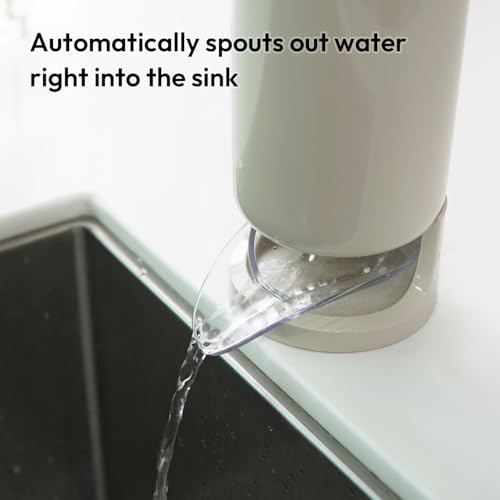 White water dispenser attached to a sink with water flowing out.