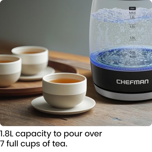 Chefman electric kettle with a cup of tea on a wooden table