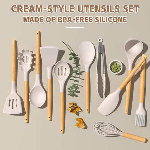 Set of cream-style utensils with wooden handles on a neutral background