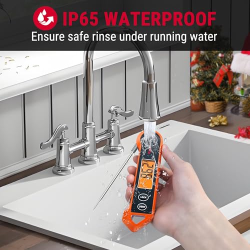 Hand holding a digital device under running water in a kitchen with IP65 waterproof text above.