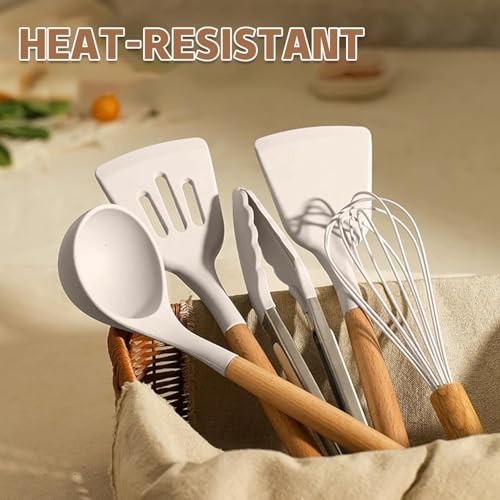 Set of heat-resistant kitchen utensils including spatulas and whisks in a basket.