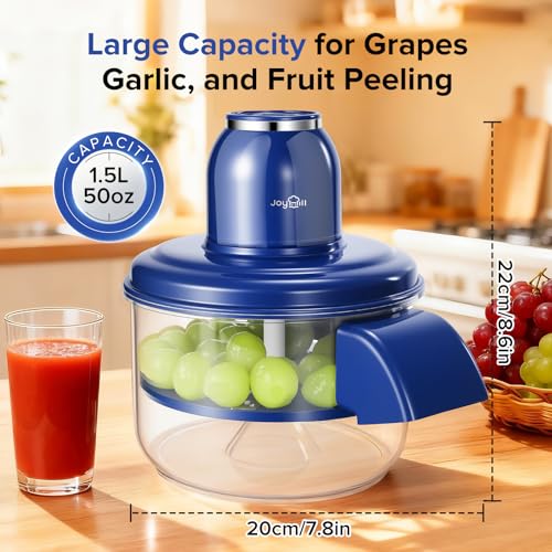 Blue kitchen chopper with grapes and a glass of juice on a wooden surface.
