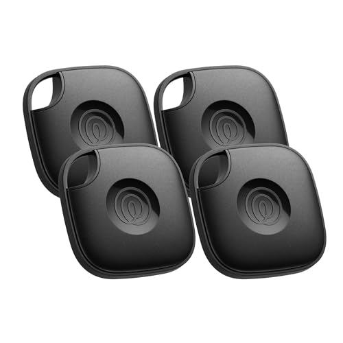 Four black wireless remote controls on a white background
