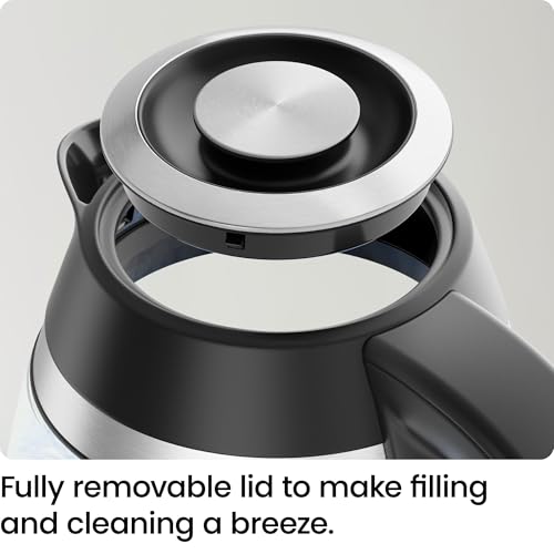 Black and silver thermos with a removable lid on a light gray background