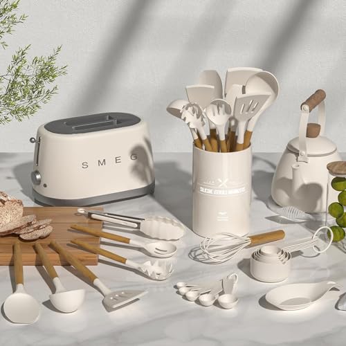 Kitchen utensils and appliances including a toaster and measuring cups on a light surface.