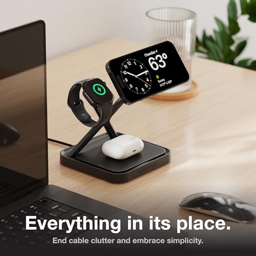 Multi-device charging stand with smartphone, smartwatch, and wireless earbuds on a desk.